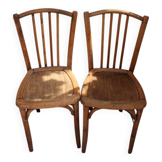 Duo of bistro chairs in bare wood, fully sanded and curved wooden backrest
