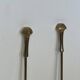 Neoclassical brass fire accessory.