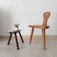 Low brutalist tripod chair in solid oak from the 1960s.