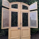Porte d'entrée cintrée double en chêne, grilles et verre, XIXème