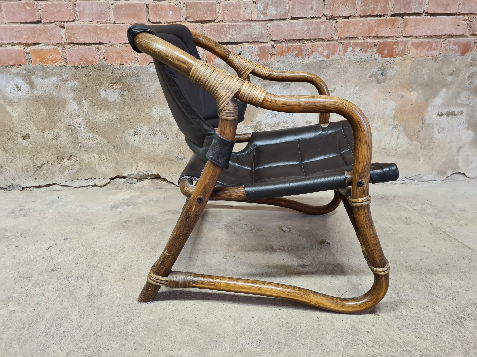 Pair of vintage skaï bamboo armchairs