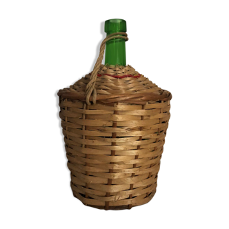 Demijohn in wicker basket