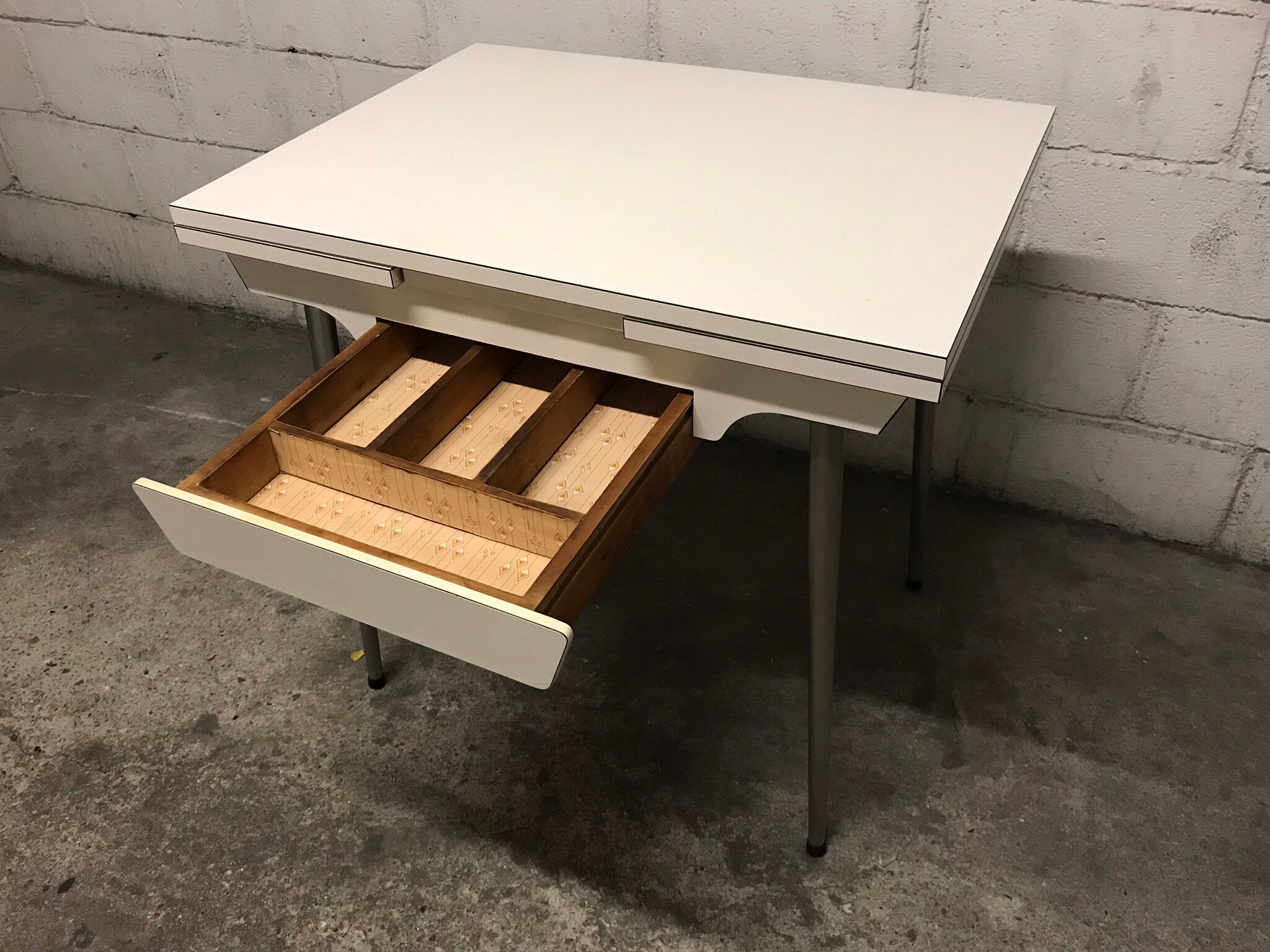 Off-white formica table / 70s cream with a tapered foot drawer