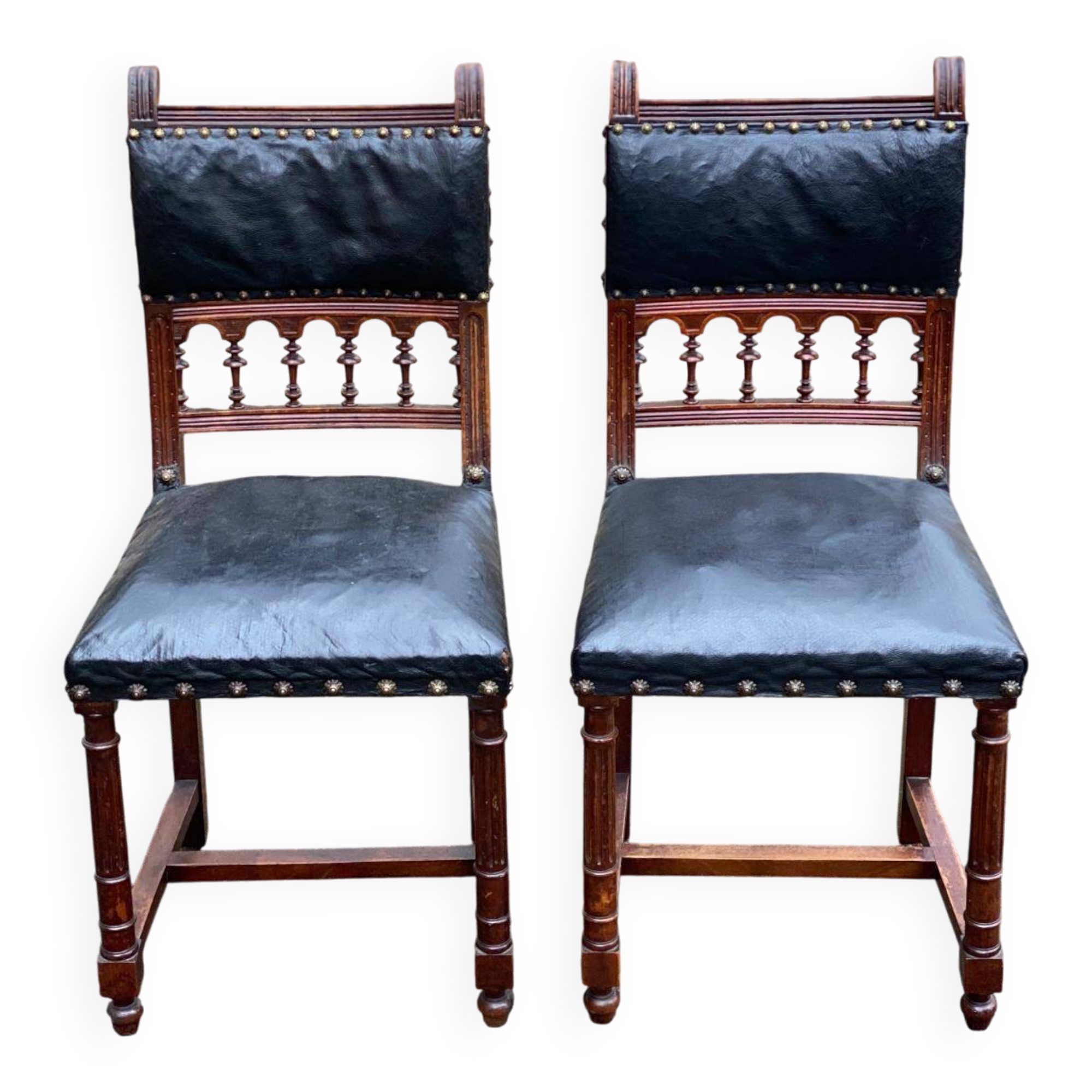 Two 19th-century Henri II chairs in solid wood and black leather upholstery