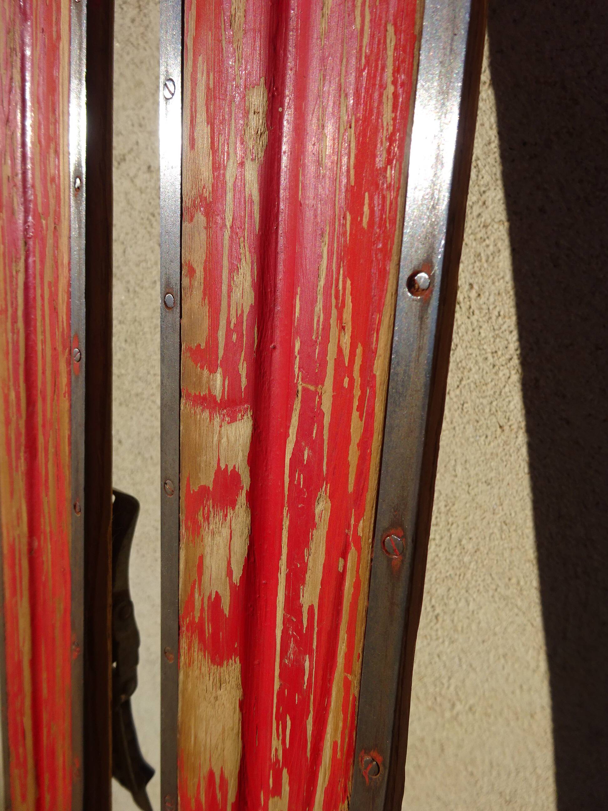 Pair of old wooden skis and metal bindings altiere