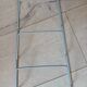 Metal wall-mounted magazine/book rack