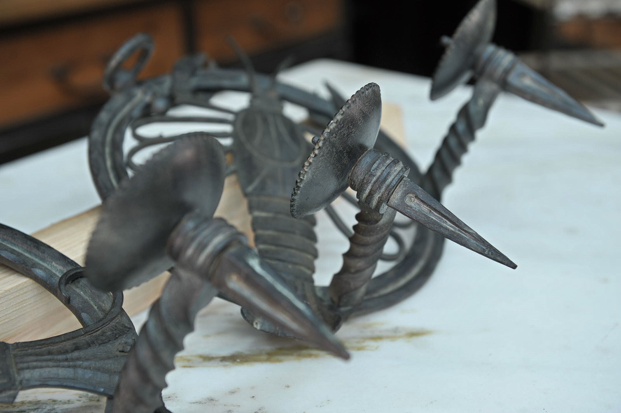 Pair of carved metal wall lamps signed RG