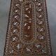 Vintage Indian teak coffee table inlaid with elephant motifs, mid-20th century.