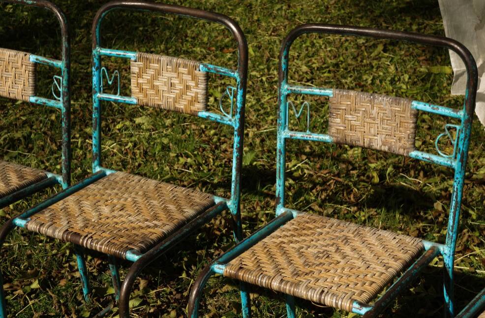 Wrought iron and rattan garden chairs