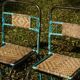Wrought iron and rattan garden chairs