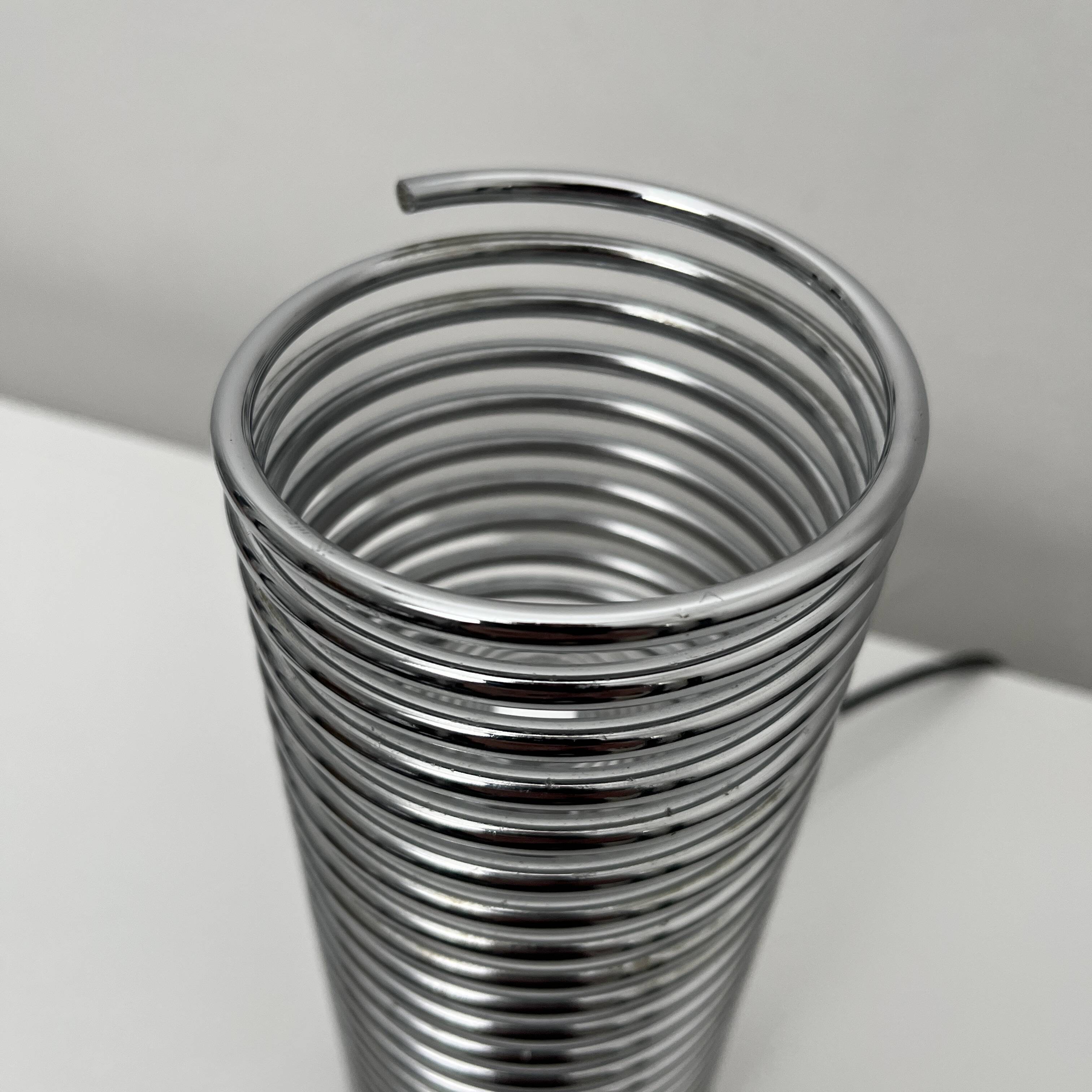 Massive chrome spring lamp