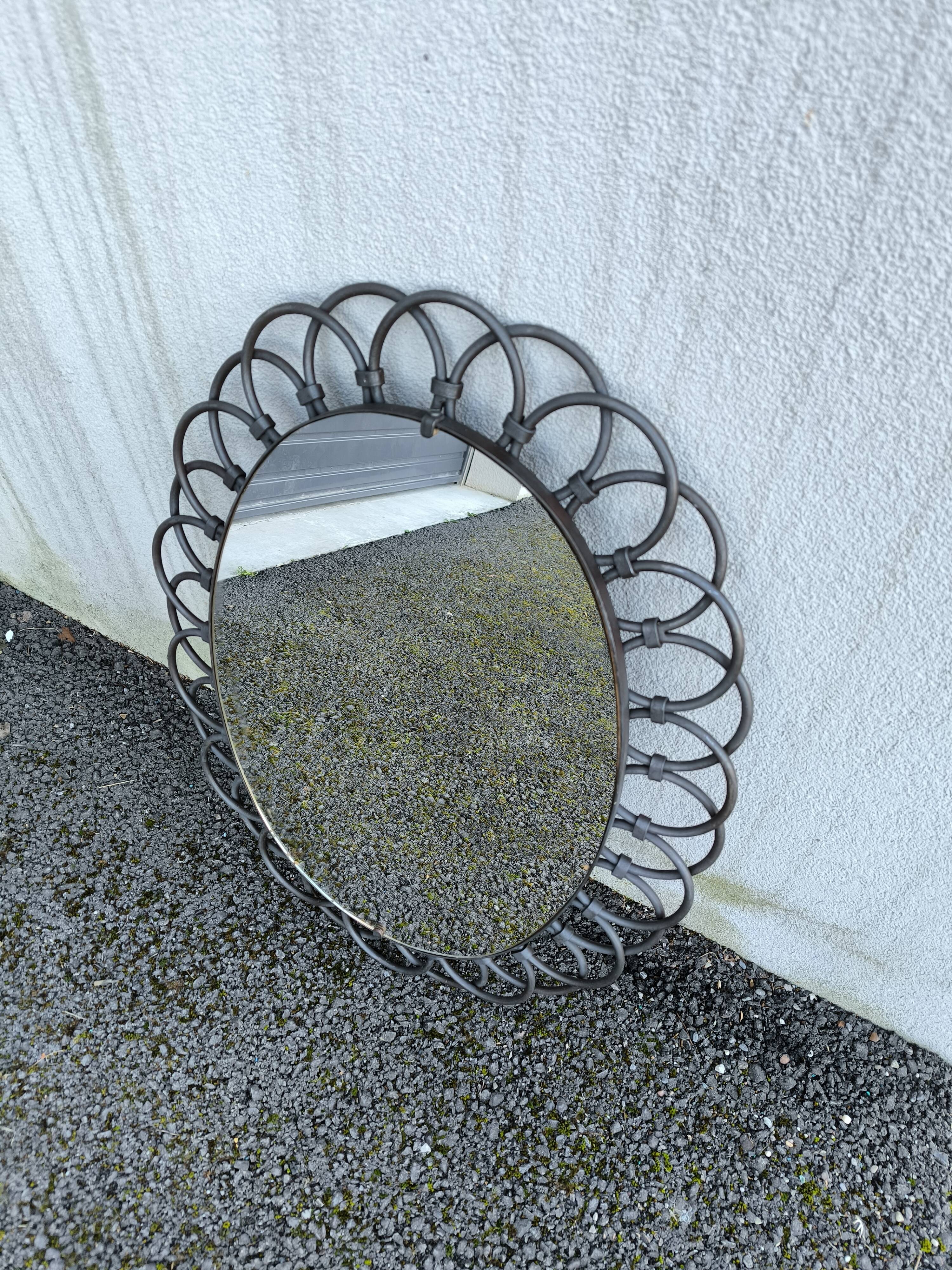 Oval metal mirror