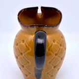 Yellow and brown ceramic pitcher