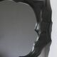 Sculptural sandstone mirror
