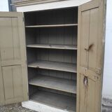Old rustic Parisian wardrobe patinated in oak and fir