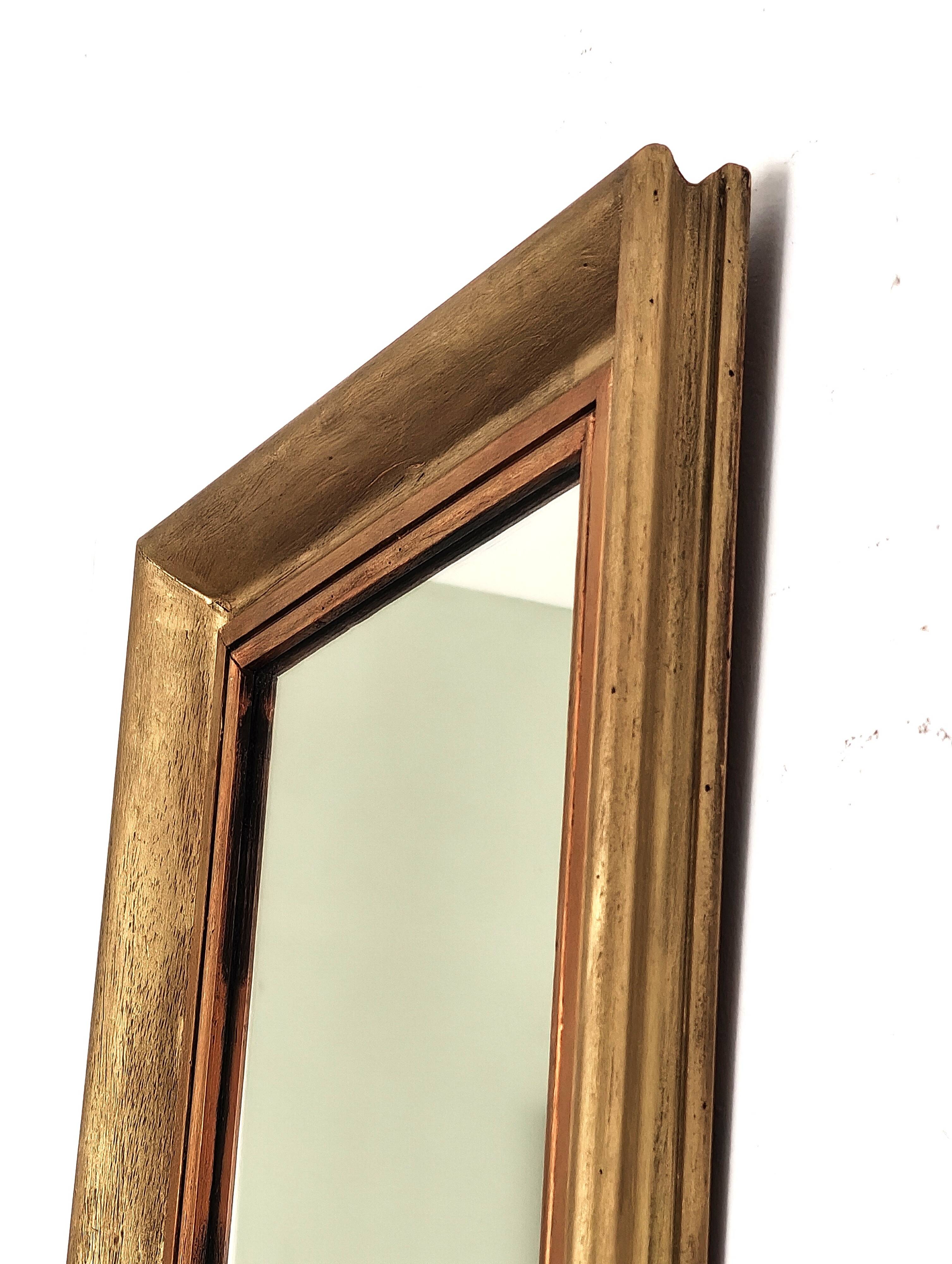 Antique mirror in gilded and copper wood