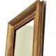 Antique mirror in gilded and copper wood