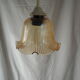 Suspension in a ribbed tulip shape, made of smoked glass.