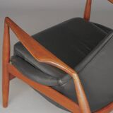Fauteuil Seal en cuir et teck Ib Kofod-Larsen pour OPE, Suède, années 1960.