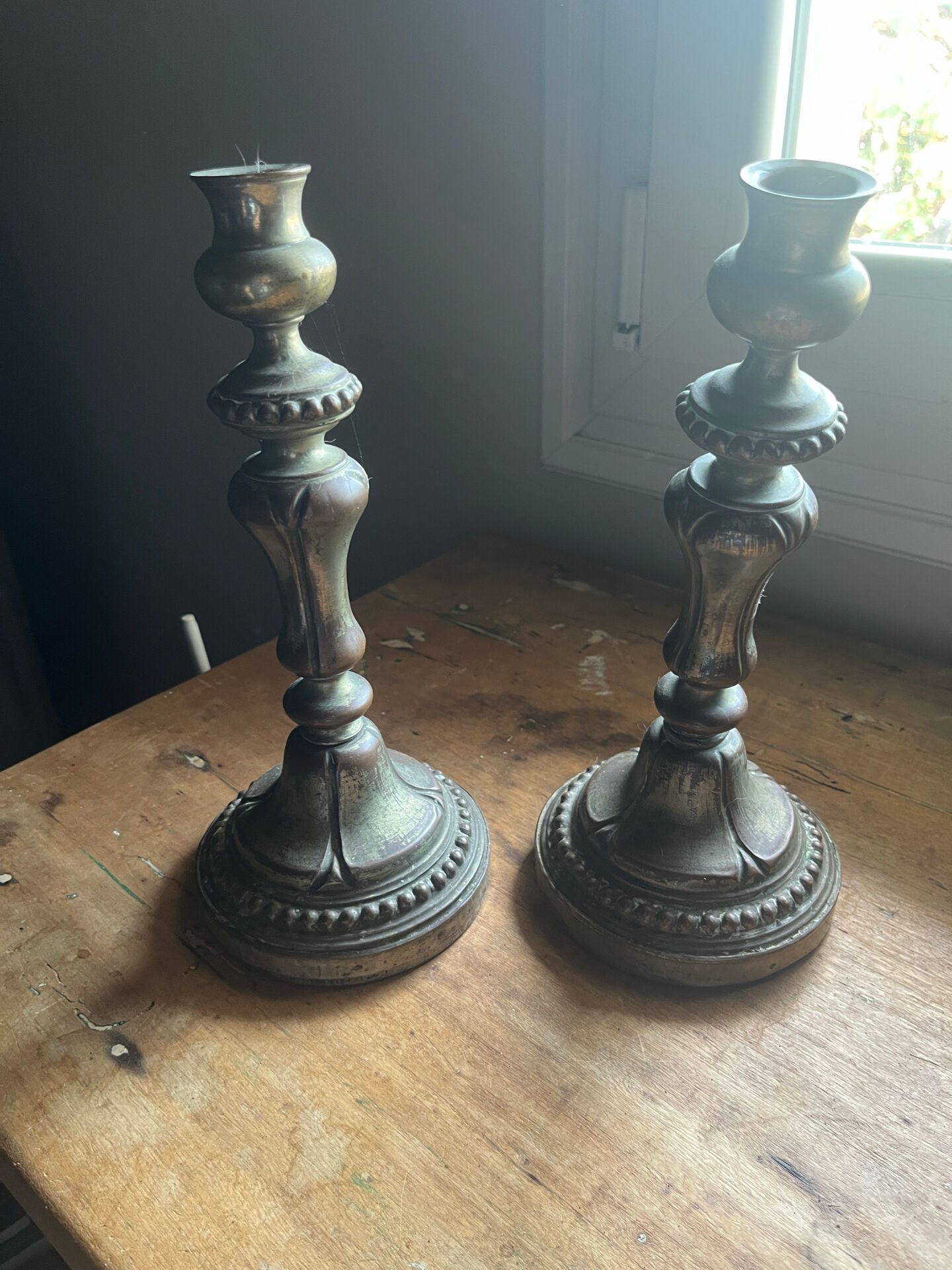 2 antique silver candlesticks