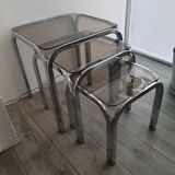 Trundle table in tubular steel and smoked glass