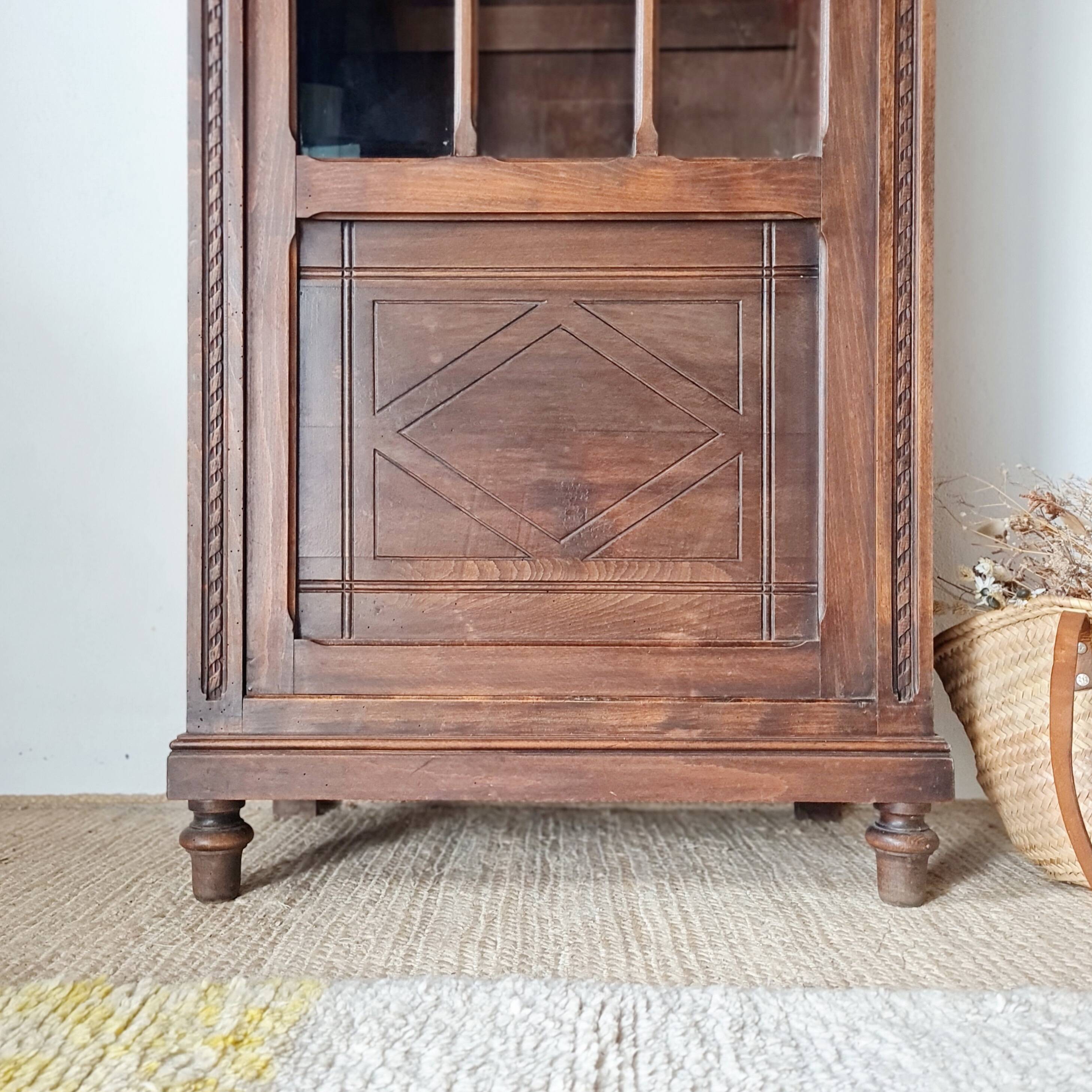 Old glass-fronted library in solid wood