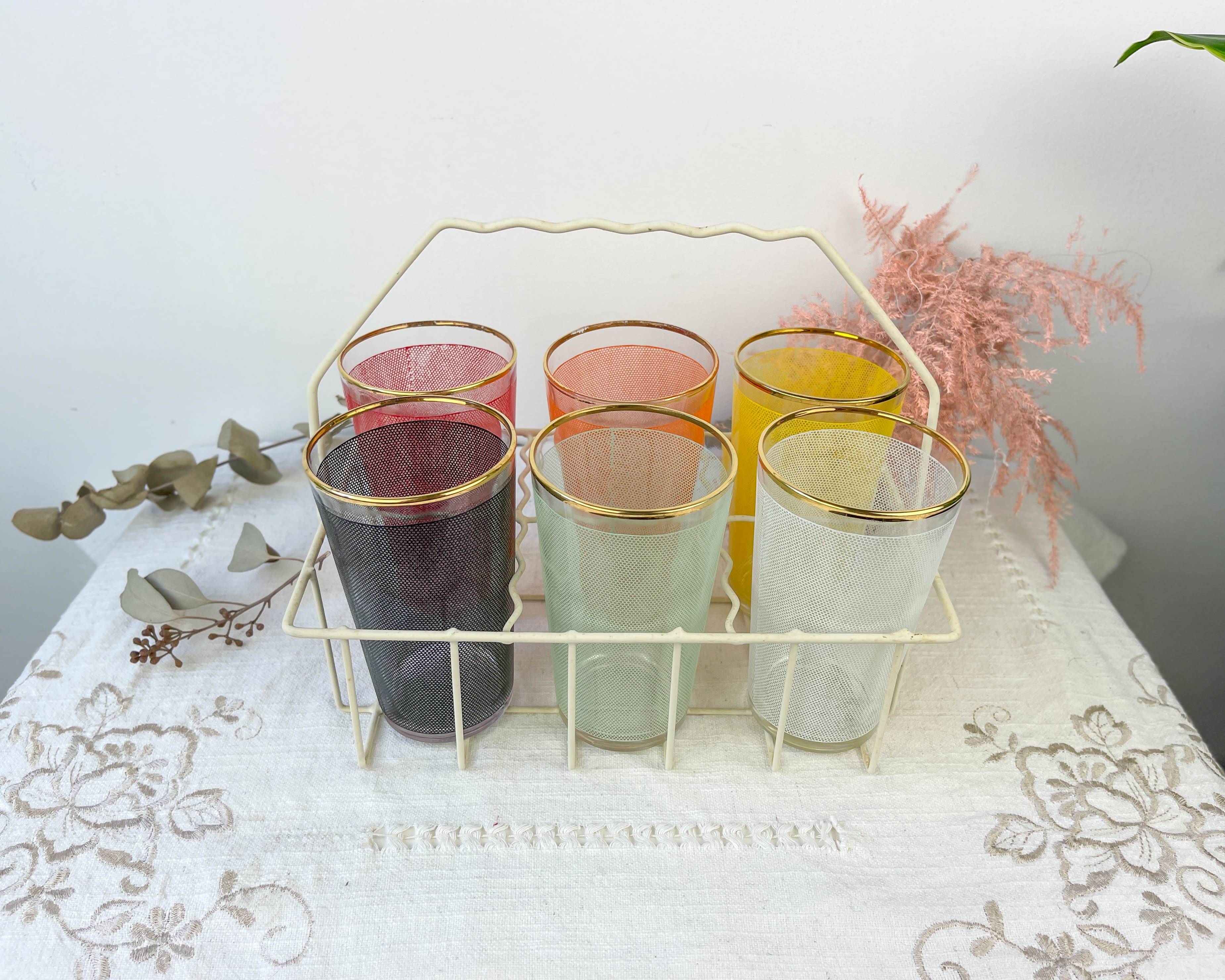 6 colorful juice glasses in their vintage basket
