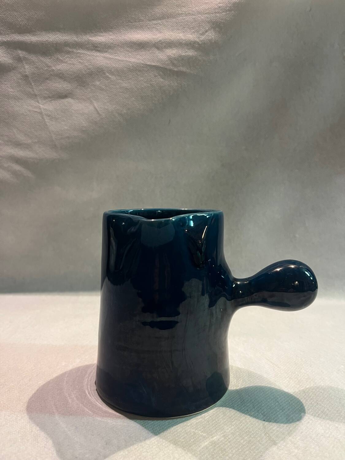 Blue ceramic milk jug