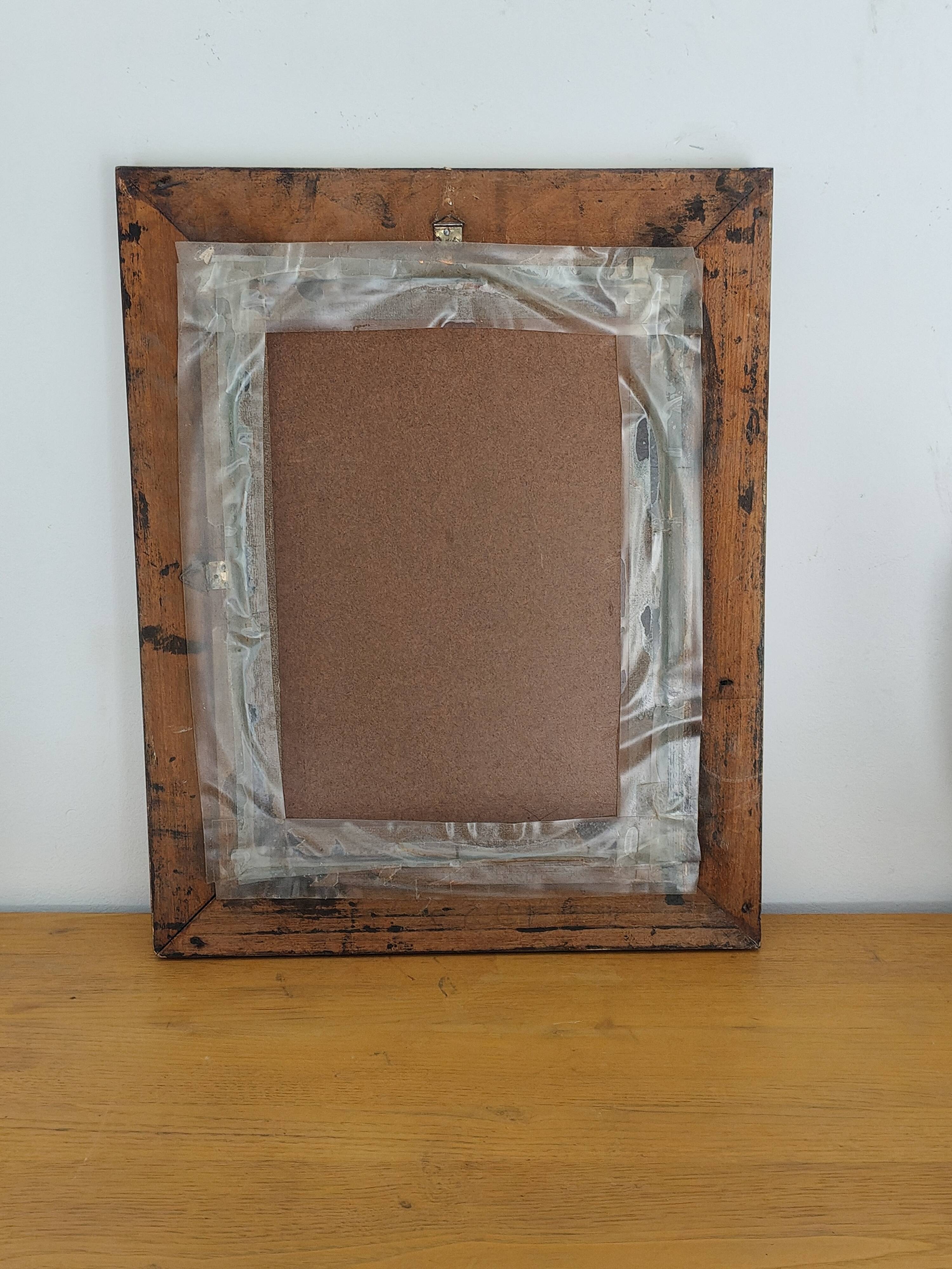 Antique mirror in gilded and copper wood