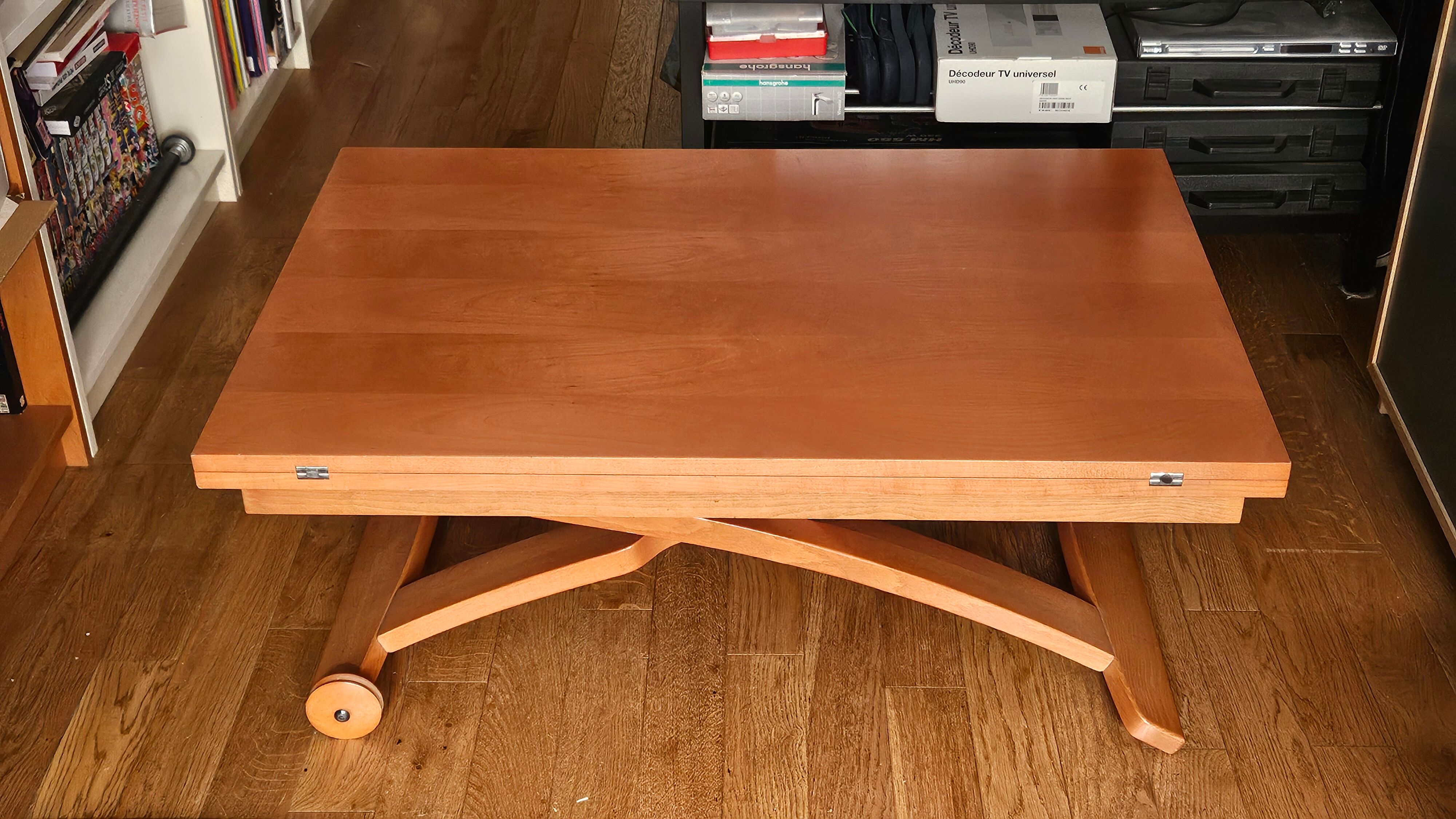 Wooden coffee table convertible into a dining table.