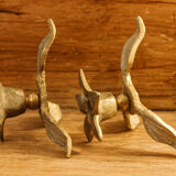 Pair of brass candle holders, flowers