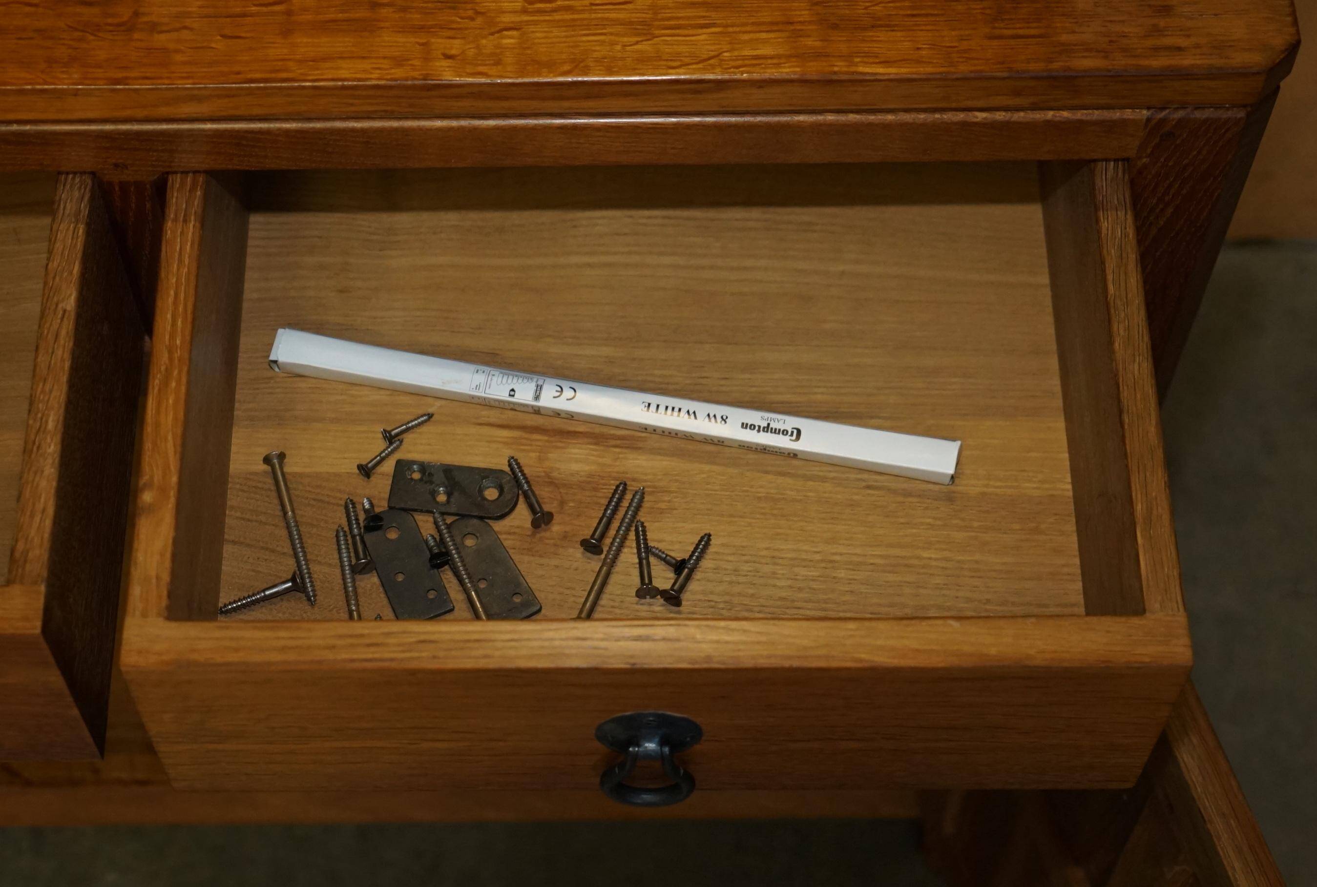 Vintage Robert Mouseman Thompson oak display cabinet with shelves and lighting.