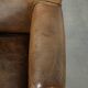 Robust cowhide armchair in a beautifully subtle size with a wonderful patina.