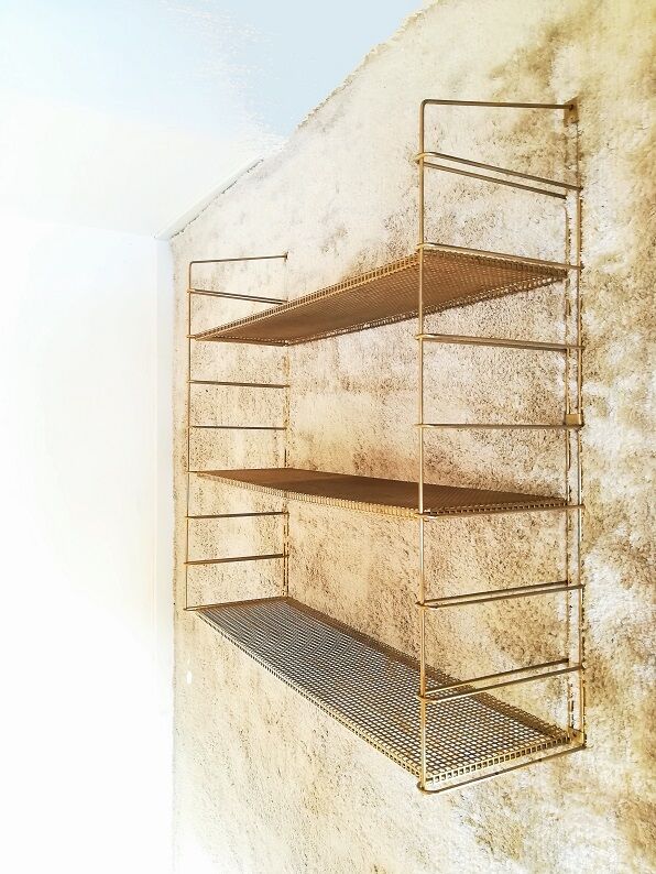 Brass gold metal wall shelf