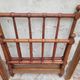 Child's bed or vintage rest bed made of solid cherry wood in a bamboo style.
