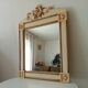 Vintage bohemian mirror from the 80s in carved wood.