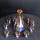 Service a liqueur, carafe en verre rose et 10 petits verres motif voilier