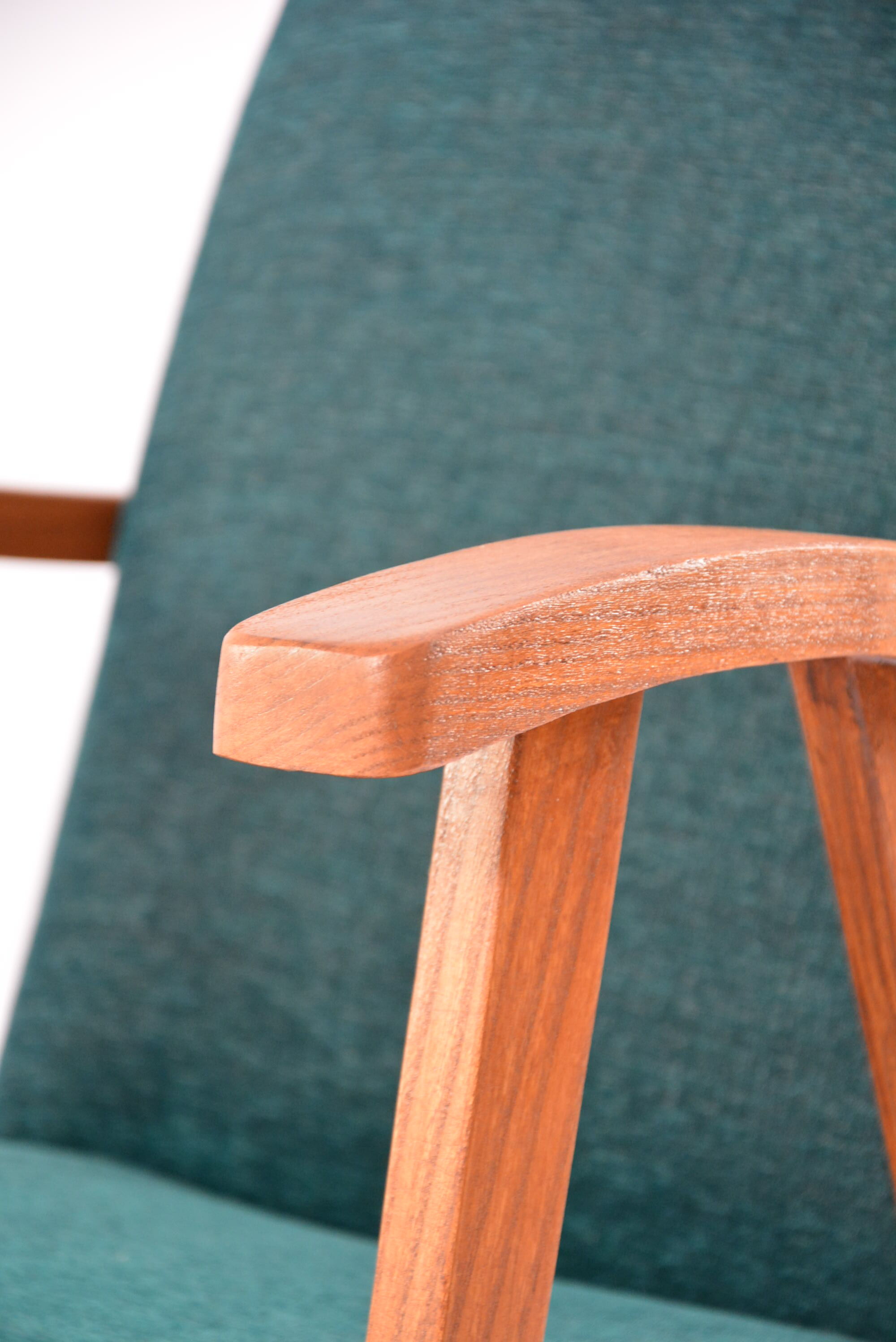 Green curved armchair