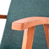 Green curved armchair