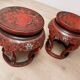 Pair of stools / Chinese side tables in red lacquered wood
