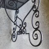 Pair of black wrought iron armchairs
