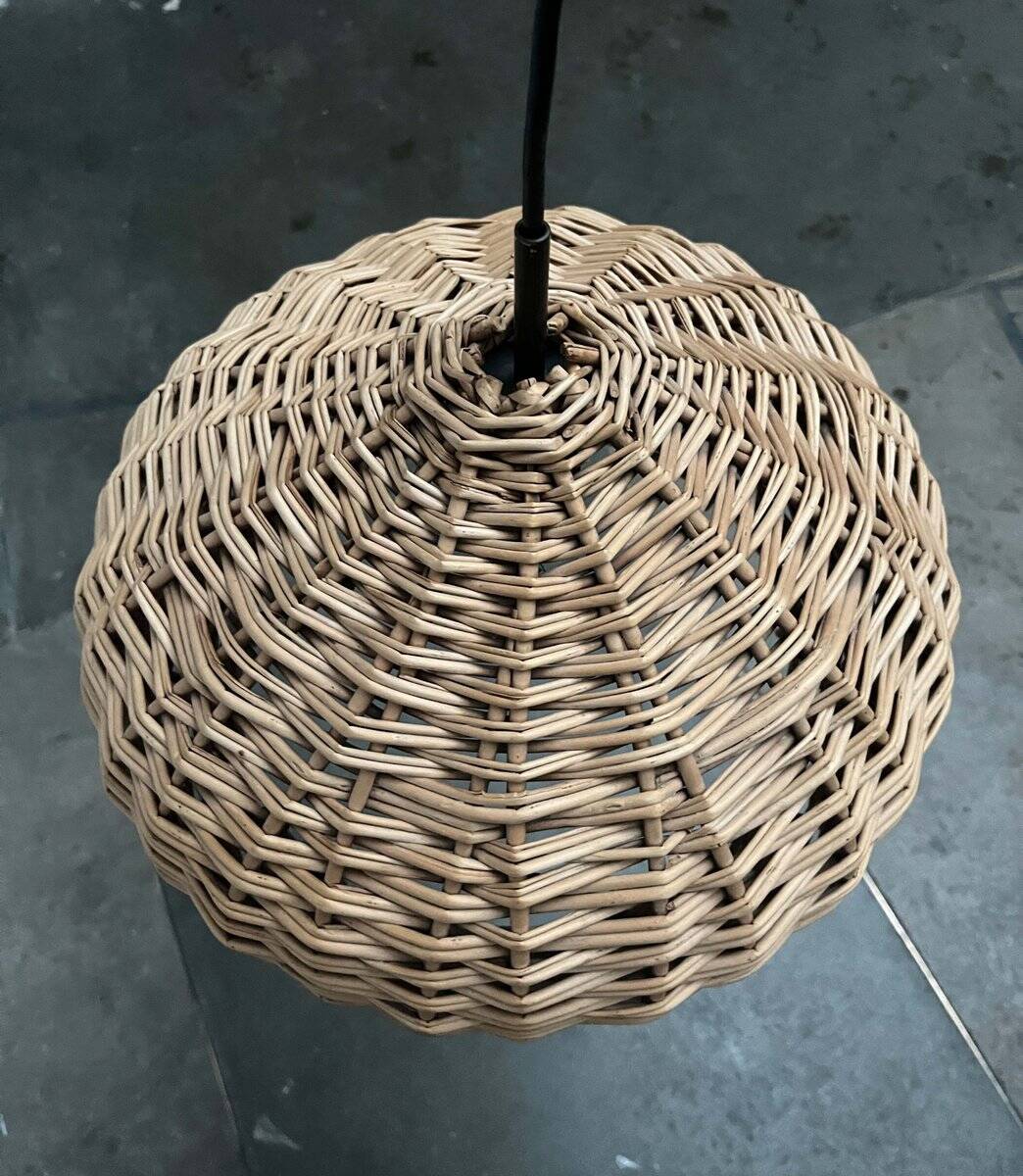 Mid-century modern Danish extendable cantilever wall lamp with a rattan shade, 1960s.