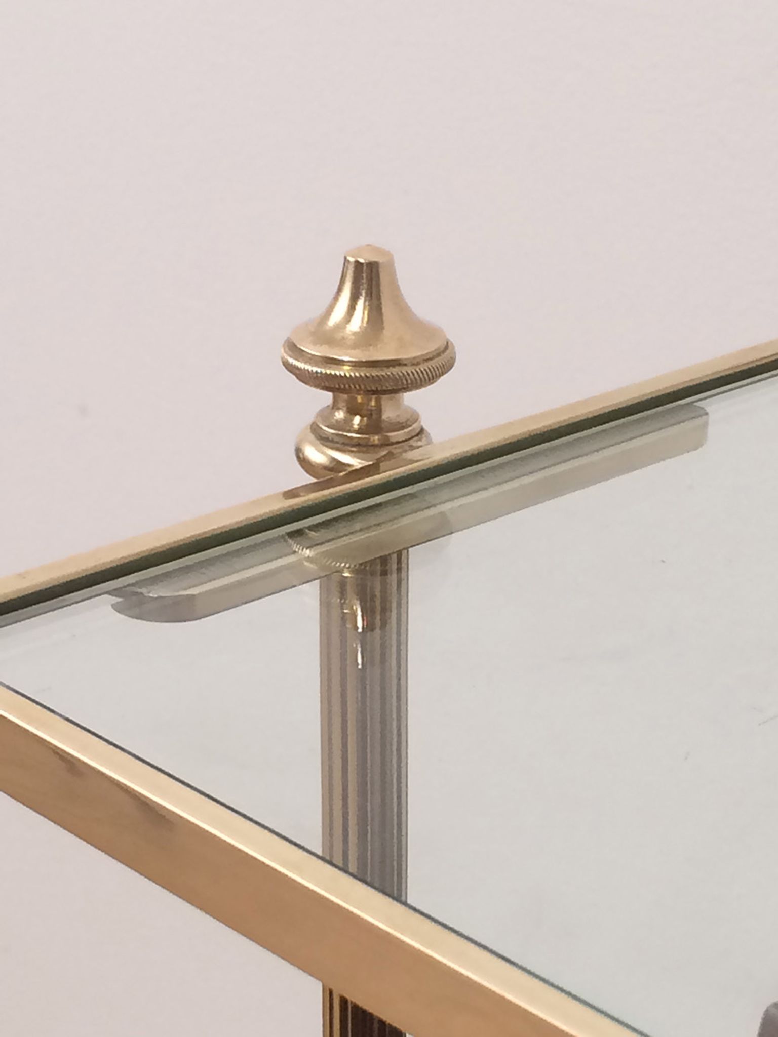 Neoclassical magazine rack in mahogany and brass