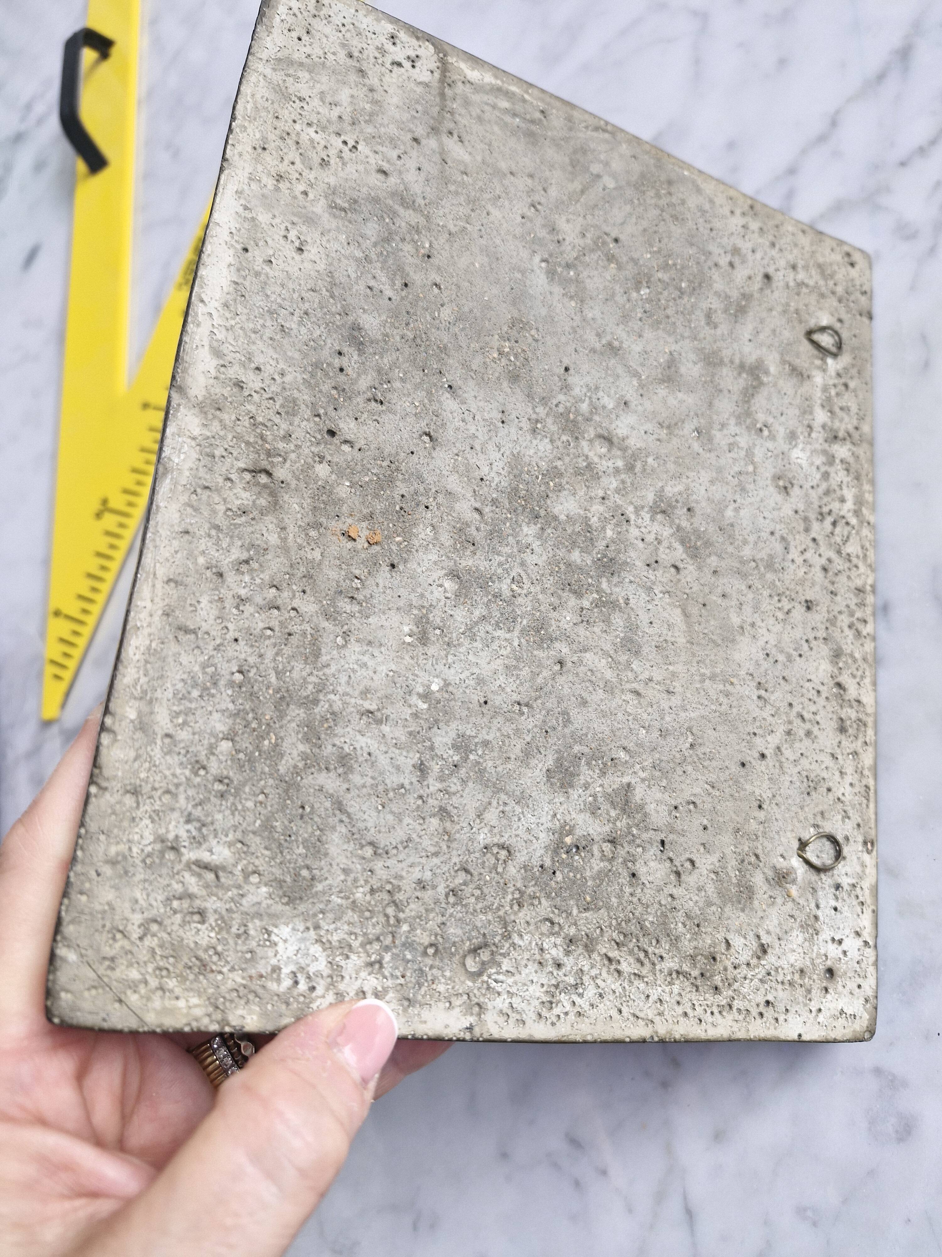 Bas-relief plaque of a rabbit in brown patina, seated cat