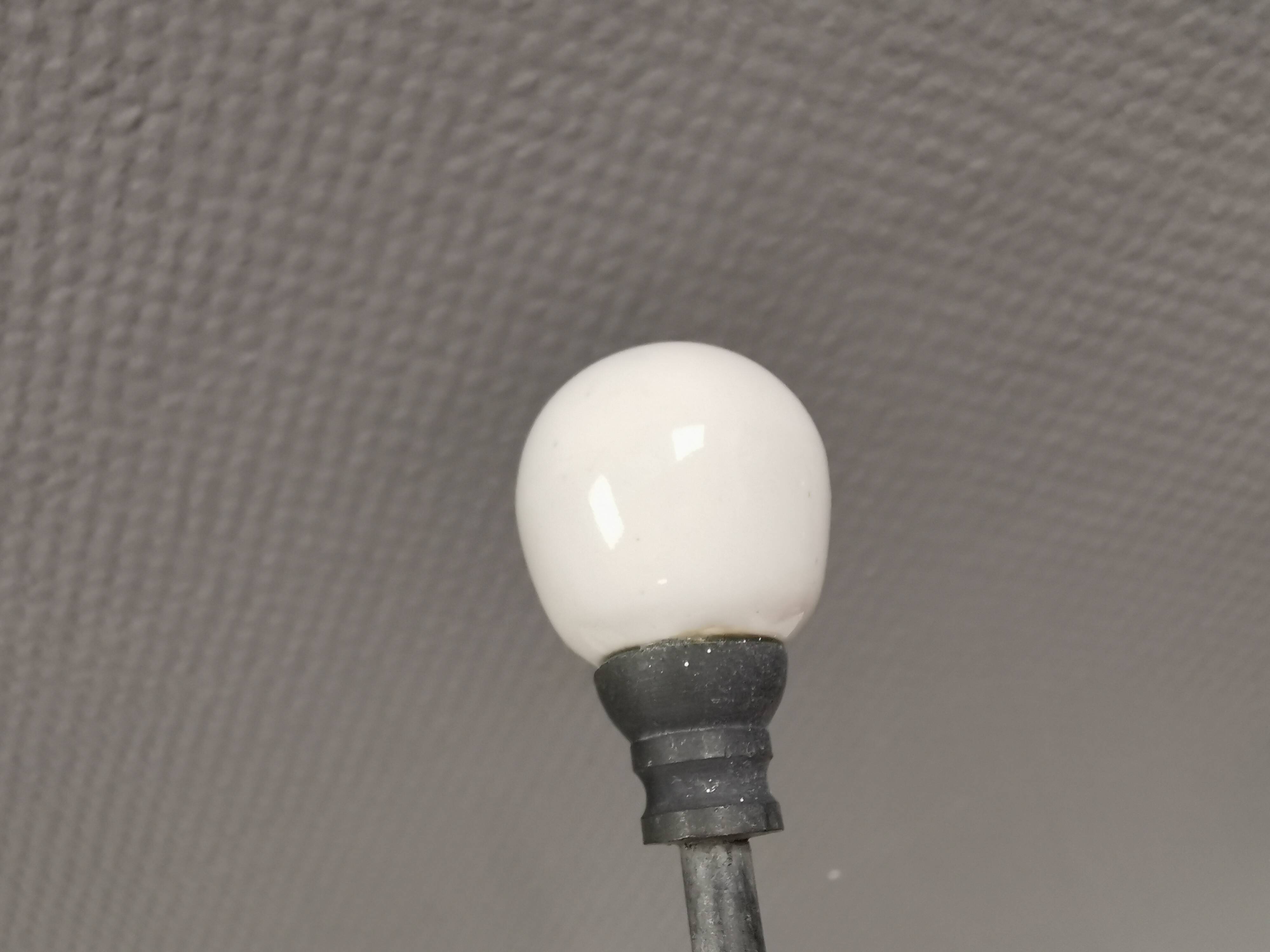 Coat hooks made of galvanized brass and raw white porcelain