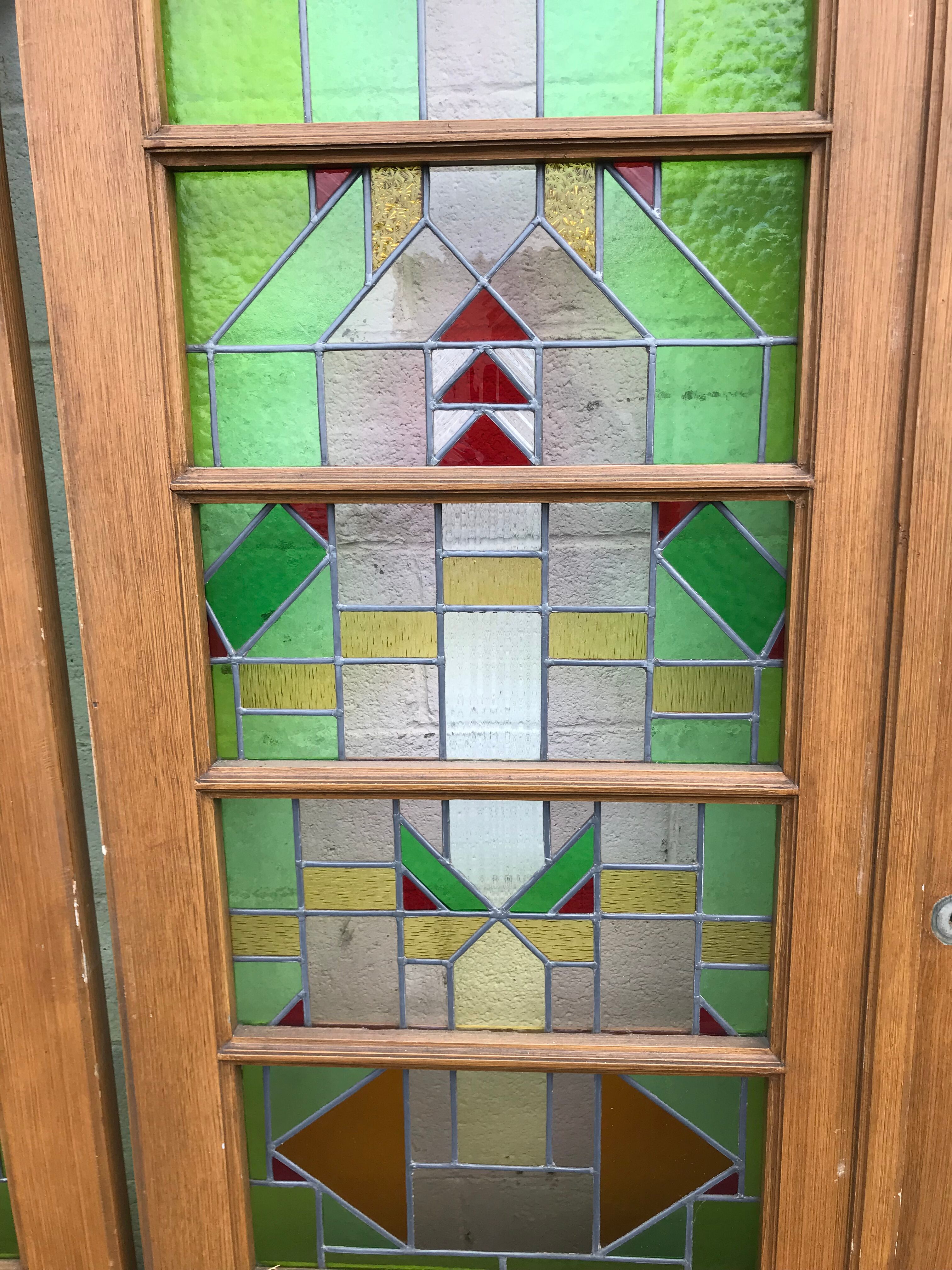 Series of three doors with stained glass windows
