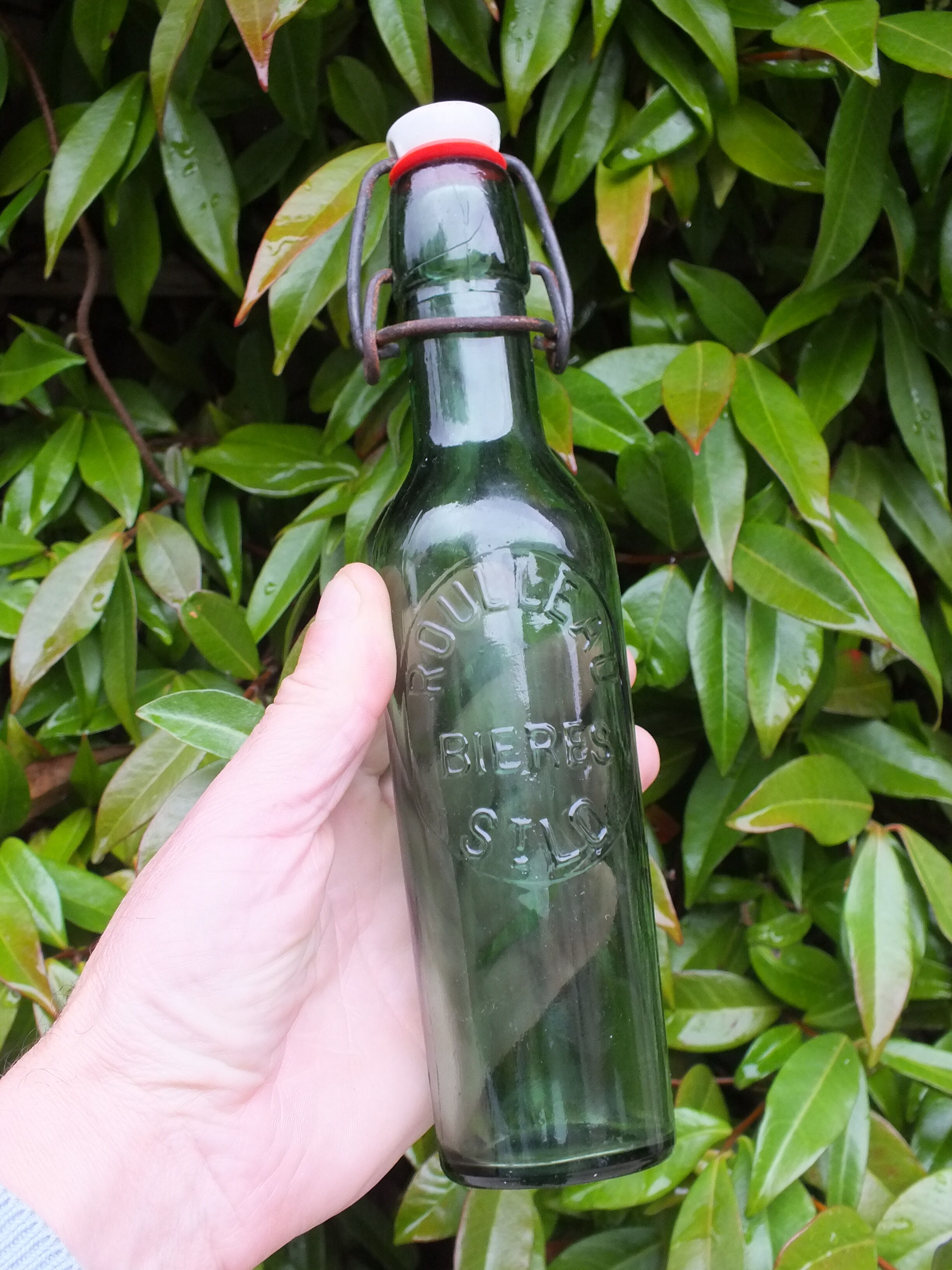 Old bottle of Roulleau beer in Saint Lô (Manche)