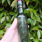 Ancienne bouteille de bière Roulleau à Saint Lô (Manche)