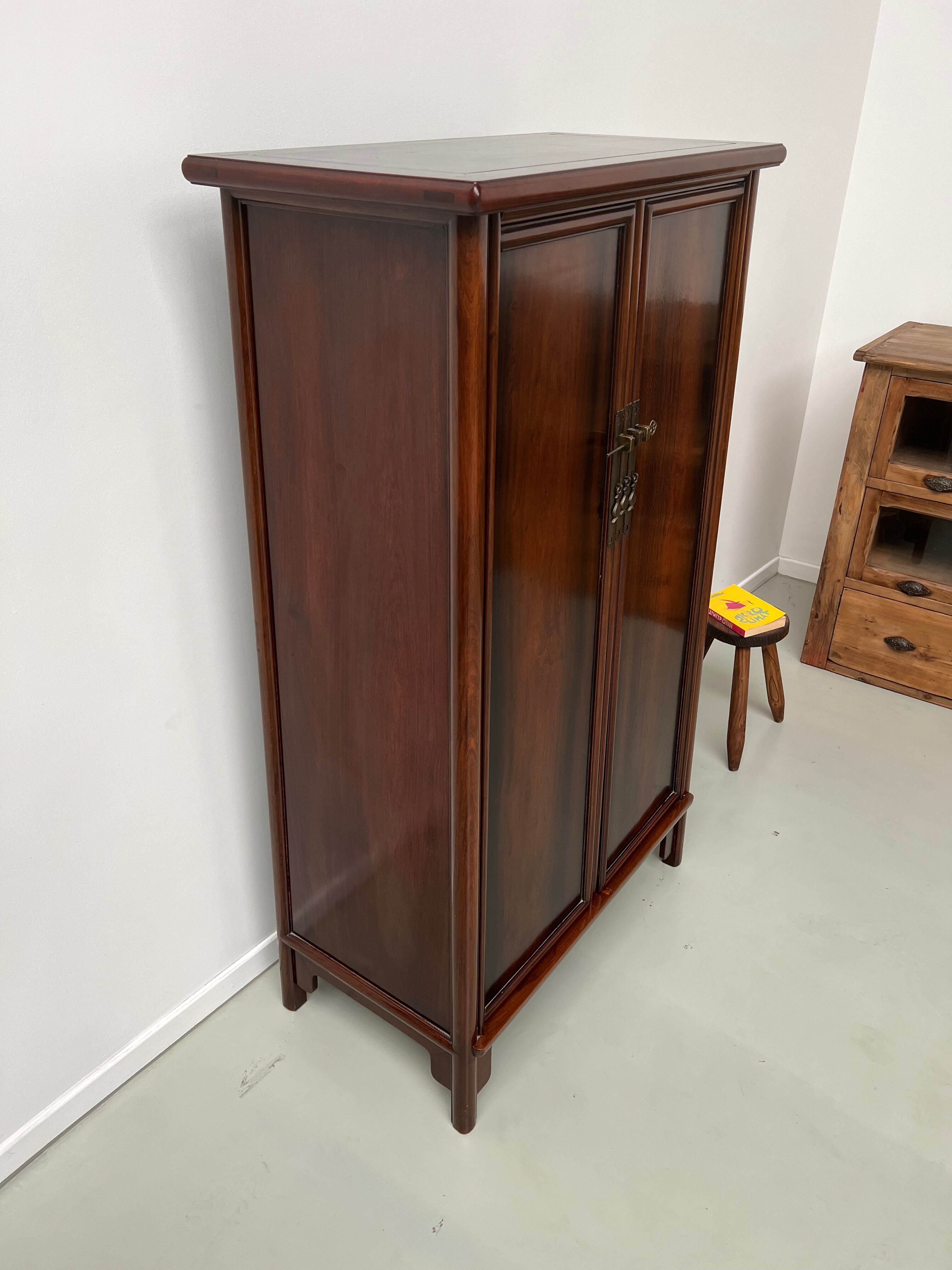 Chinese trapezoidal roller cabinet, made of rosewood.