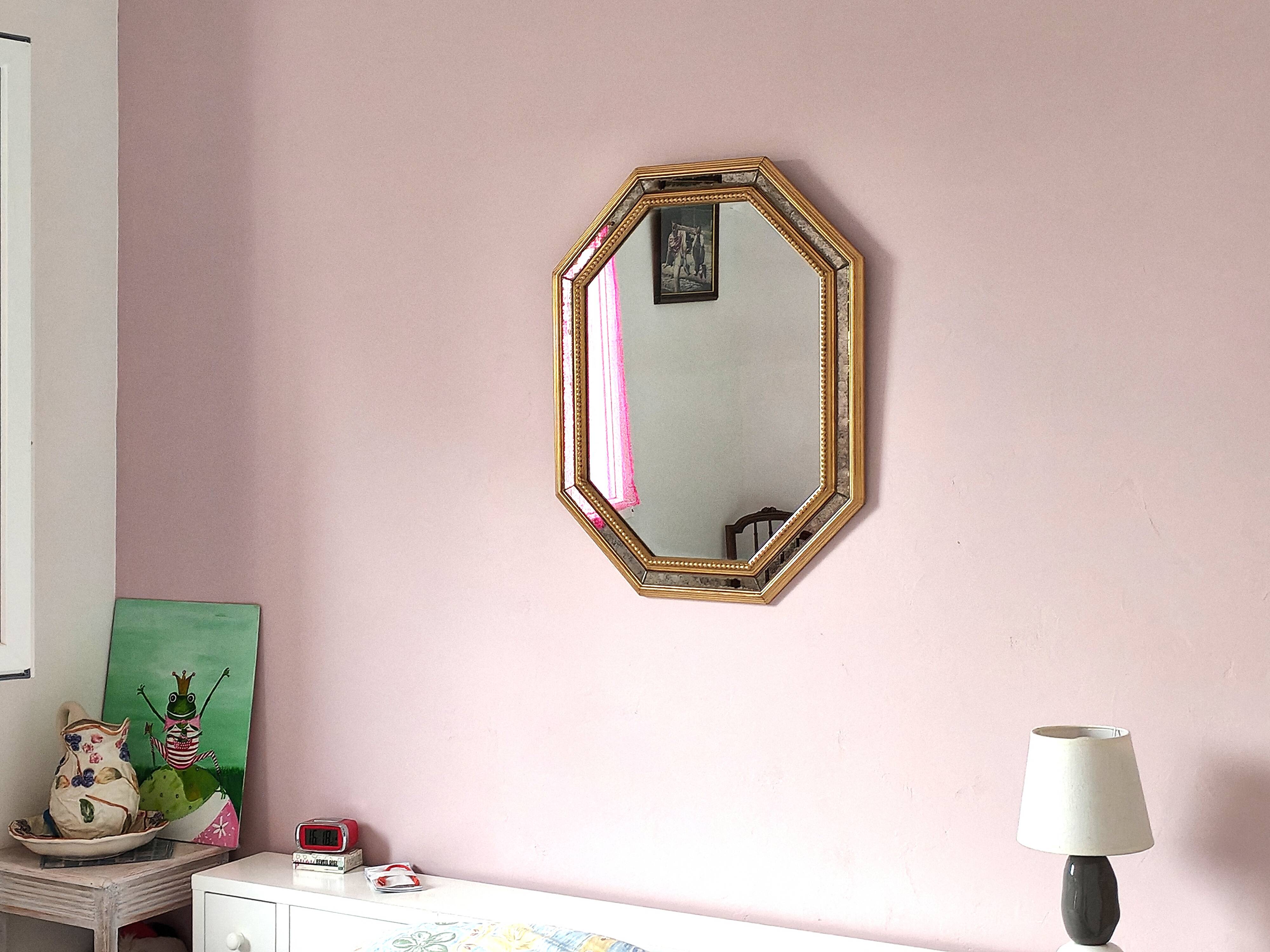 Antique mirror with gilded wooden frame.